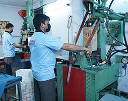 An Employee working on wheel lathe machine