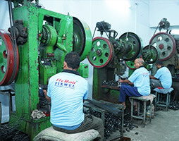 Employees working on wheel balancing machine